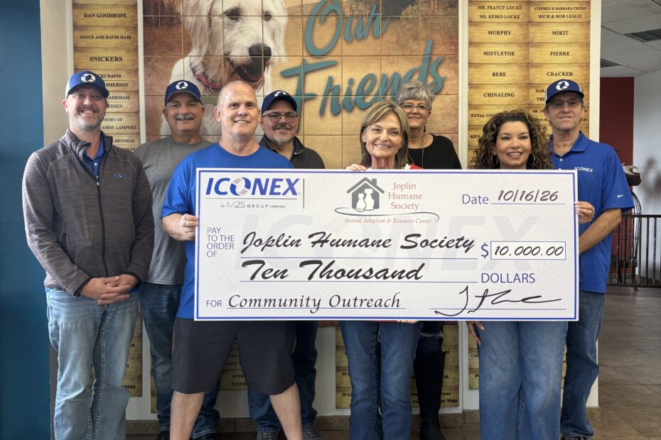 Iconex Joplin employees present a $10,000 donation check to the Joplin Humane Society.